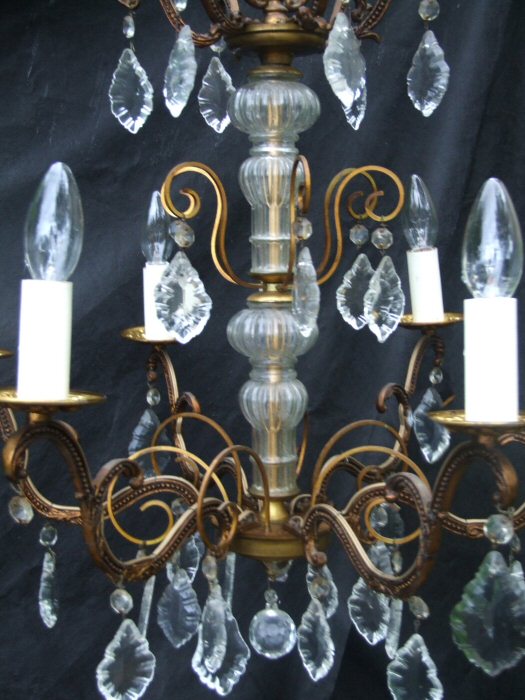 Circa 1900 A 6 arm patinated Brass and Crystal Chandelier 