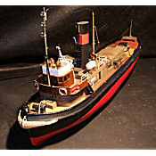 antique model of a tug boat