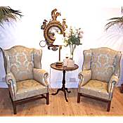 pair of matching Edwardian wing armchairs in the Georgian style