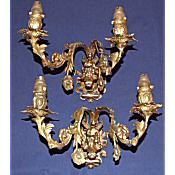 large antique pair of brass wall lights with cherub decoration