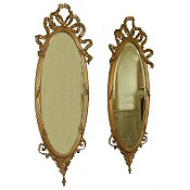 pair of Victorian oval gilt wall mirrors