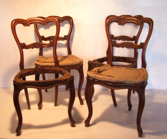 Four Victorian walnut balloon back dining chairs