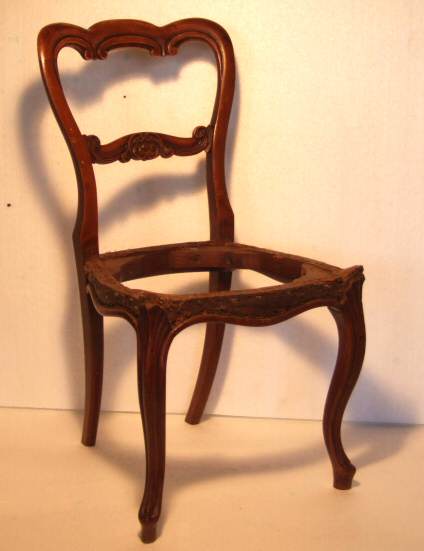 Four Victorian walnut balloon back dining chairs