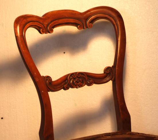 Four Victorian walnut balloon back dining chairs