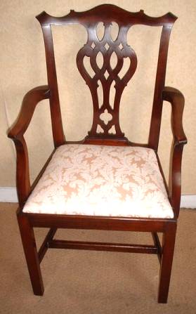 Edwardian solid mahogany open arm chair