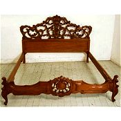 Highly ornate baroque queen sized Walnut bed